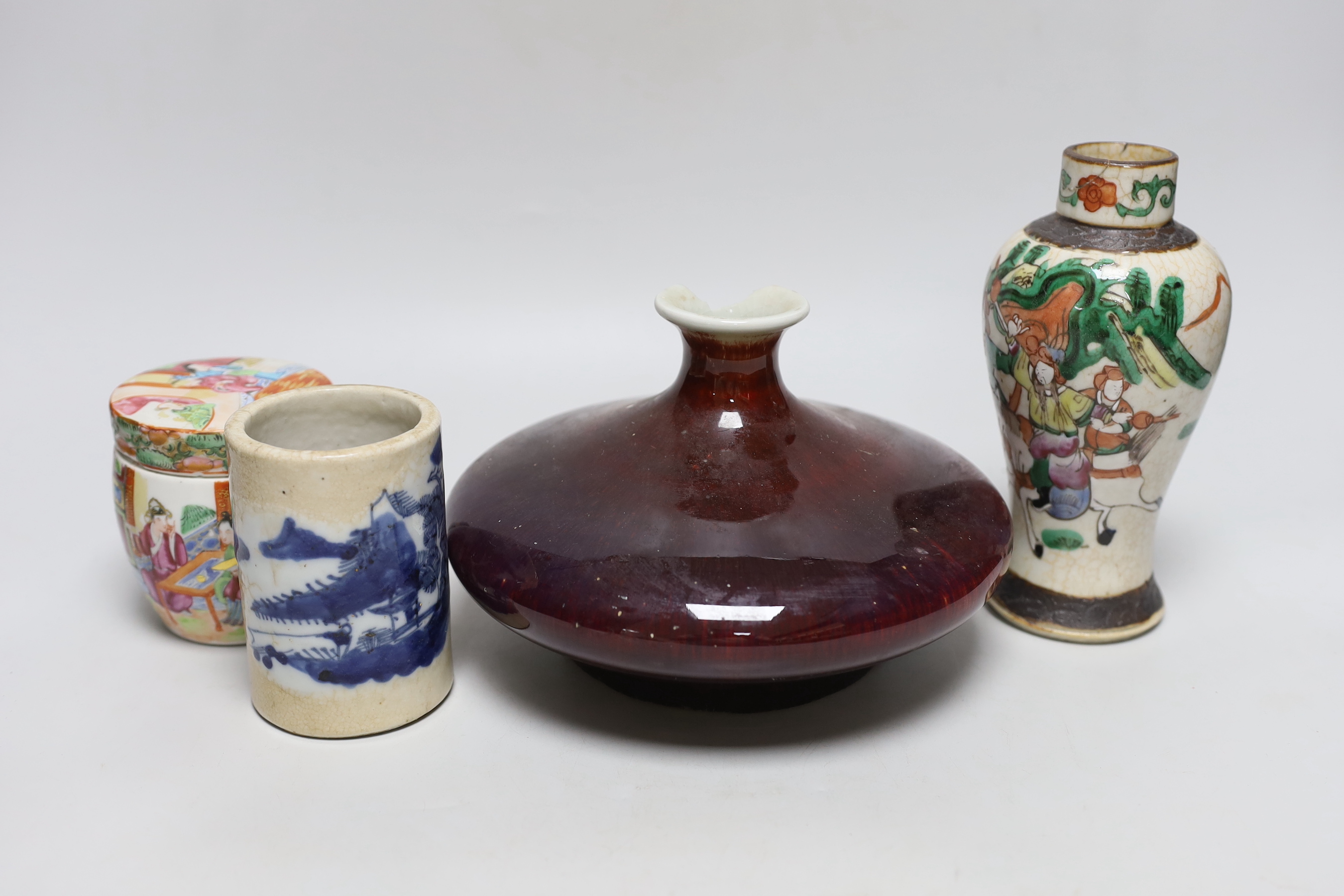 A Chinese sang de boeuf glazed squat vase, a crackle ware vase, a box and cover and a blue and white brush pot, tallest 18.5cm high